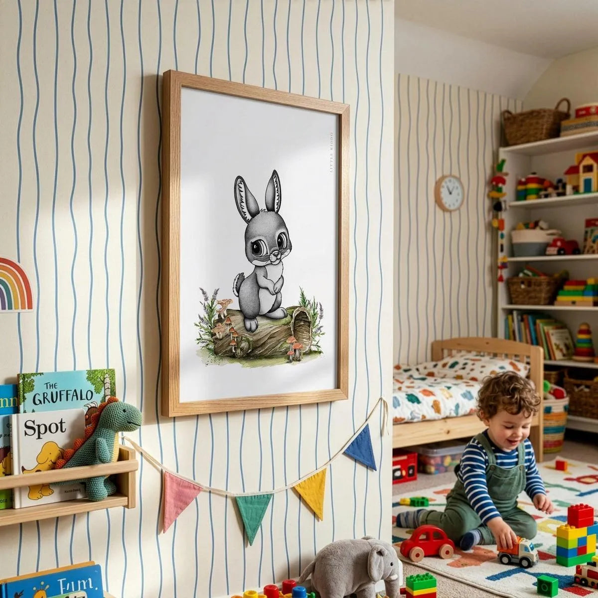 Framed bunny-rabbit adventure poster for kids, styled in a bright playroom with striped wallpaper and colorful bunting.