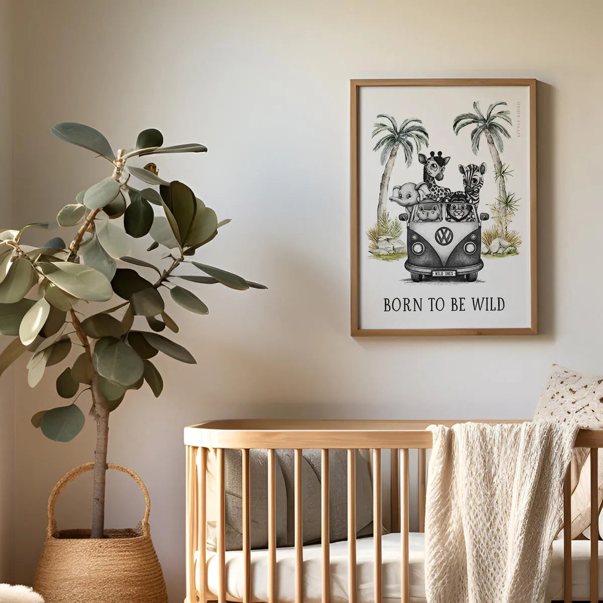Minimalist safari animal art print hanging above a wooden baby crib, gender-neutral nursery decor for a sophisticated baby room.