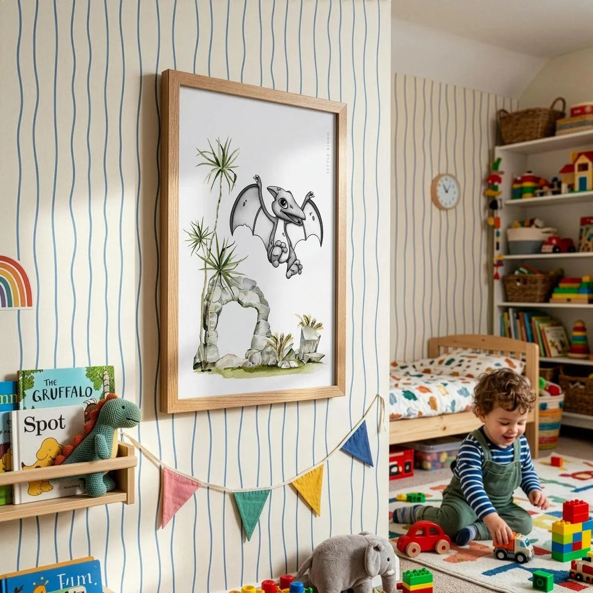 Whimsical dinosaur bedroom decor featuring framed flying pterodactyl print in a modern neutral nursery.