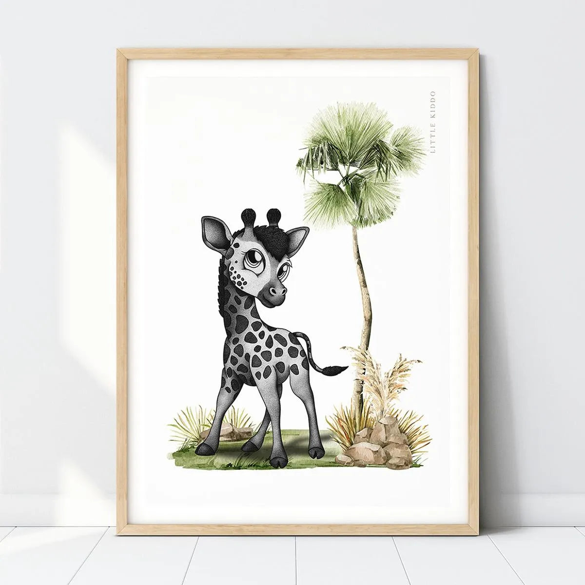 Hand-drawn baby giraffe nursery art print with a palm tree in a light wood frame, neutral safari-themed wall decor for kids.