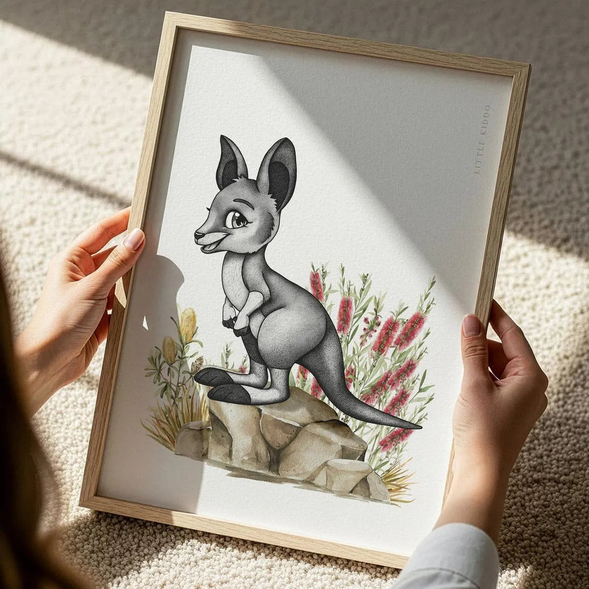 Close-up of a hand-inked kangaroo illustration for a kids' room, featuring detailed stippling and soft watercolor native Australian florals.