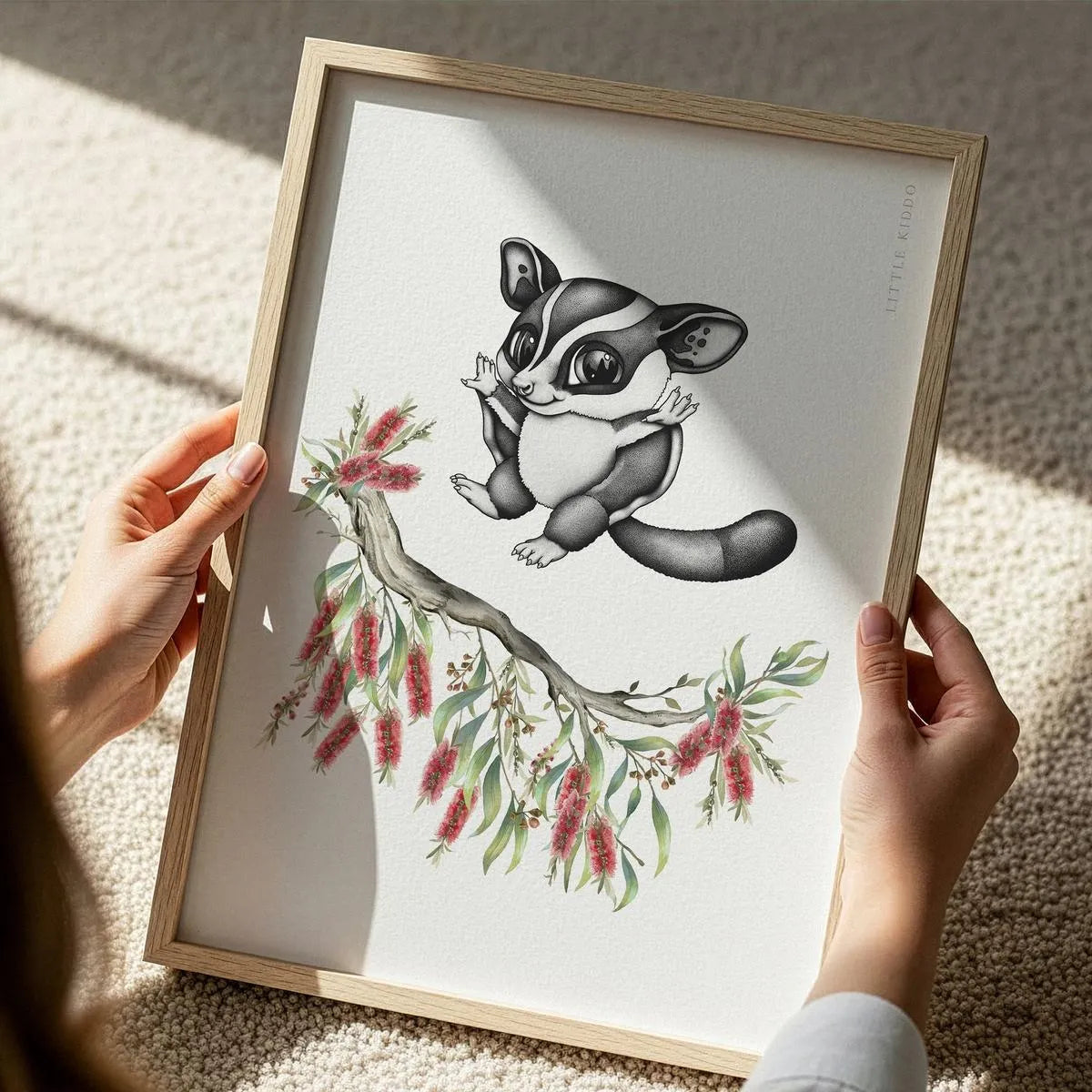 Close-up of a framed sugar glider art print showing intricate ink textures and native Australian botanical details.