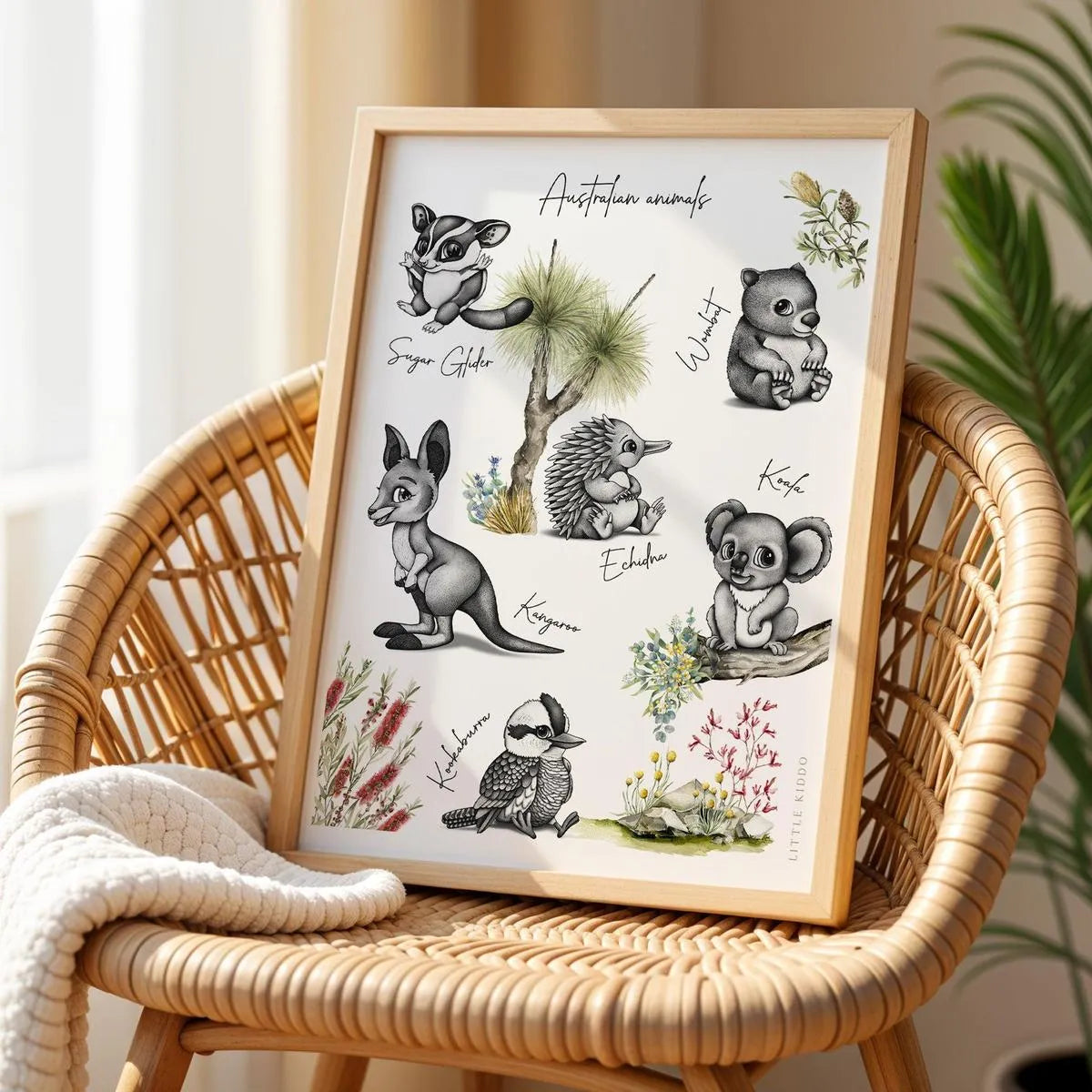 Whimsical Outback Friends animal poster for kids room, displayed on a rattan chair in a neutral-toned nursery.