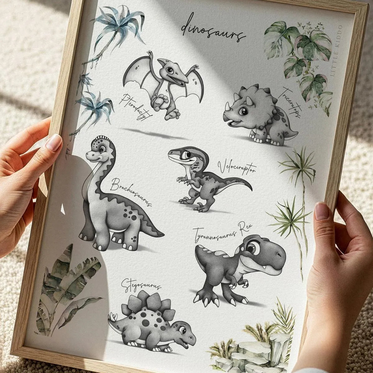Close-up of a hand-inked dinosaur illustration poster for kids, featuring detailed stippling of prehistoric animals and palm trees.