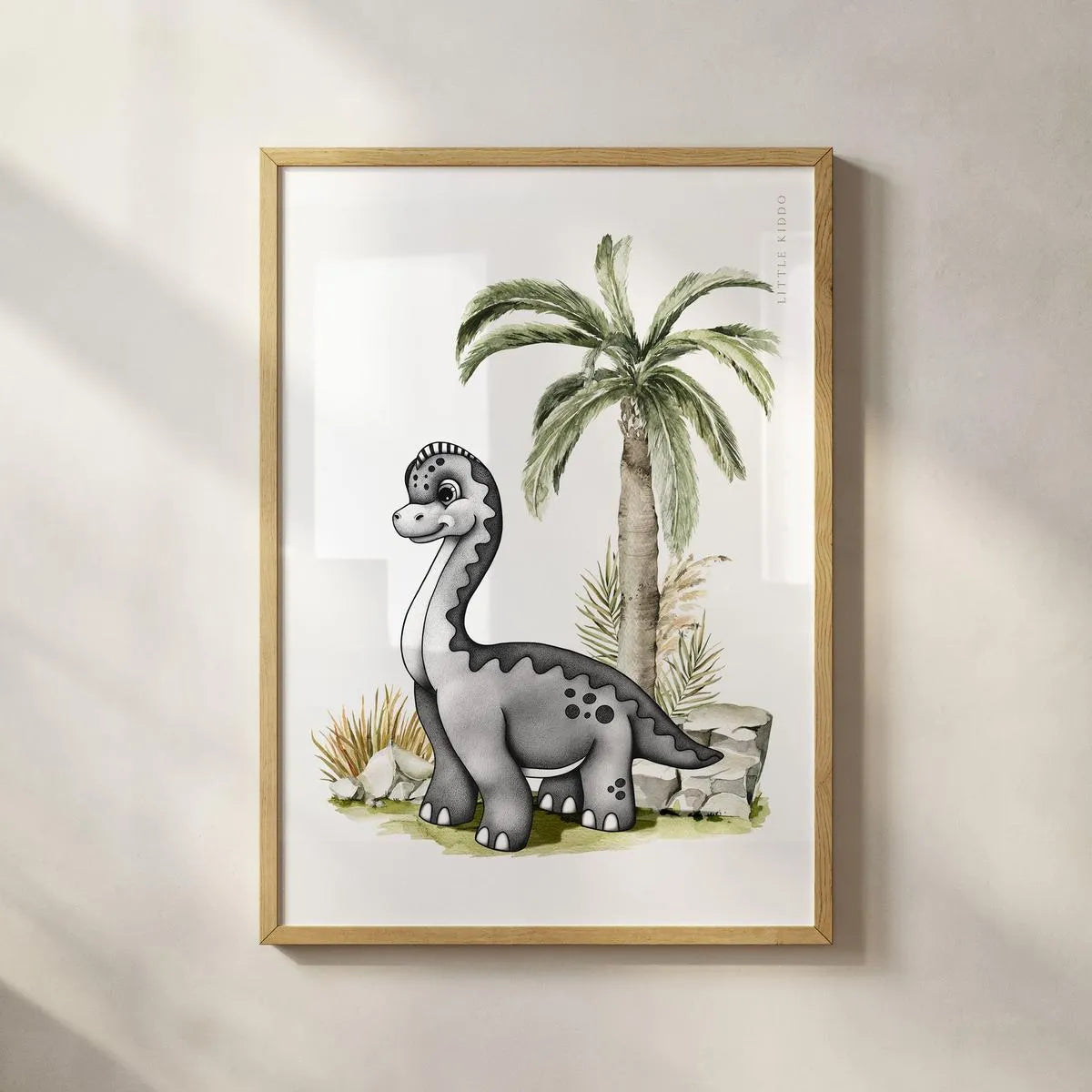 Minimalist Brachiosaurus art print in a light wood frame, artisanal prehistoric animal wall hanging for a modern baby room.