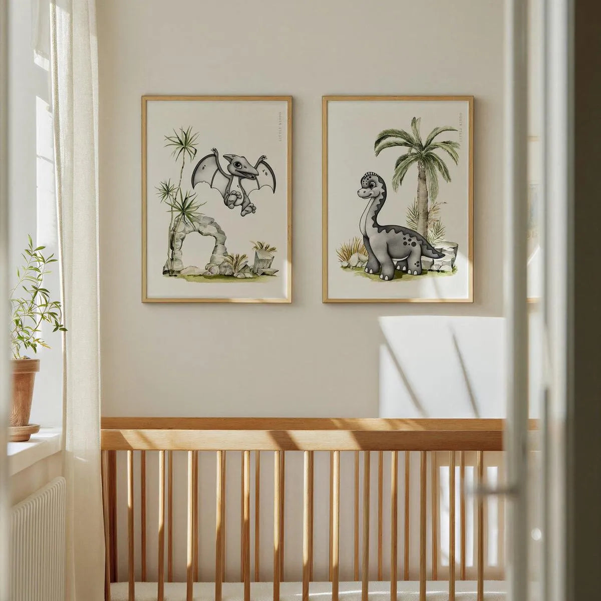 Set of 2 dinosaur wall art prints hanging above a wooden crib, minimalist prehistoric nursery theme.