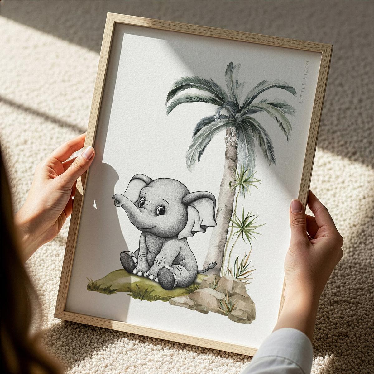 Close-up detail of a person holding the framed safari animal print in natural sunlight