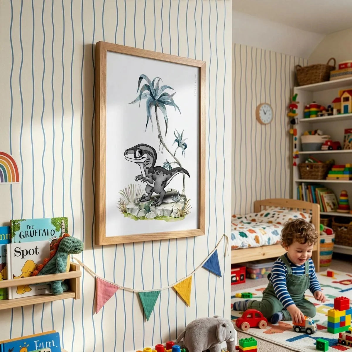 Sophisticated dinosaur nursery wall art styled in a bright children’s room with blue striped wallpaper. The hand-drawn raptor illustration features detailed black and white stippling and soft watercolor palm trees in a timber frame.