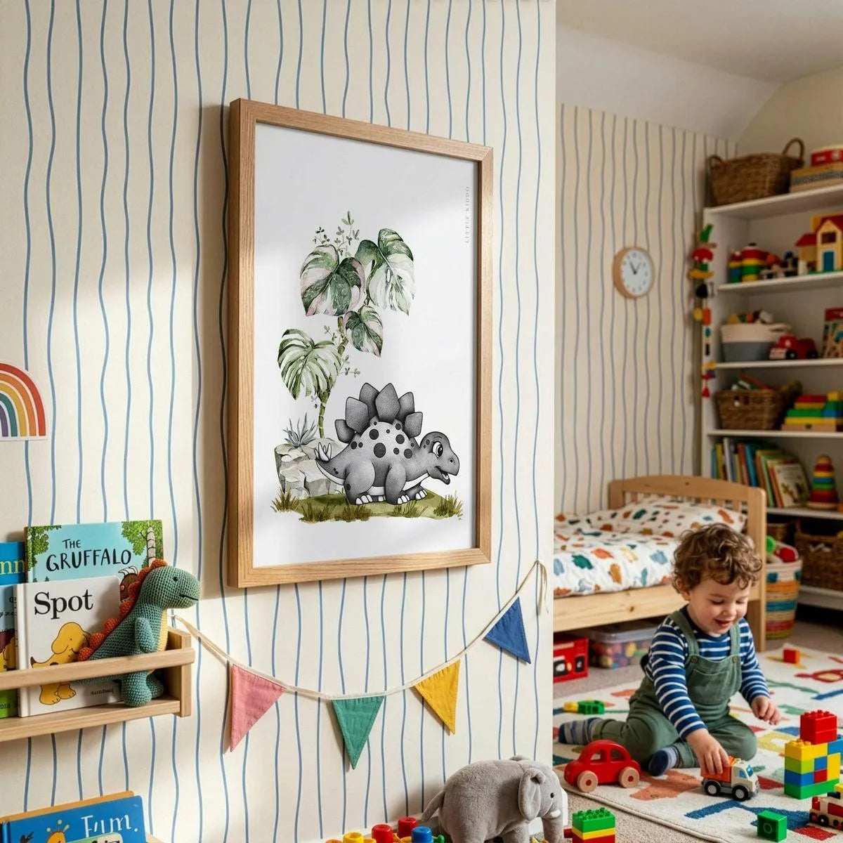 Framed Stegosaurus adventure poster for kids, styled in a bright playroom with striped wallpaper, colorful bunting, and a toddler playing.